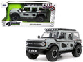 2021 Ford Bronco Gray with Black Stripes with Roof Rack "Own the Night" "Just Trucks" Series 1/24 Diecast Model Car by Jada